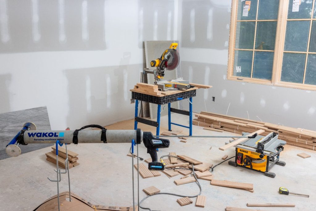 Job site setup before hardwood floor installation in Durham home