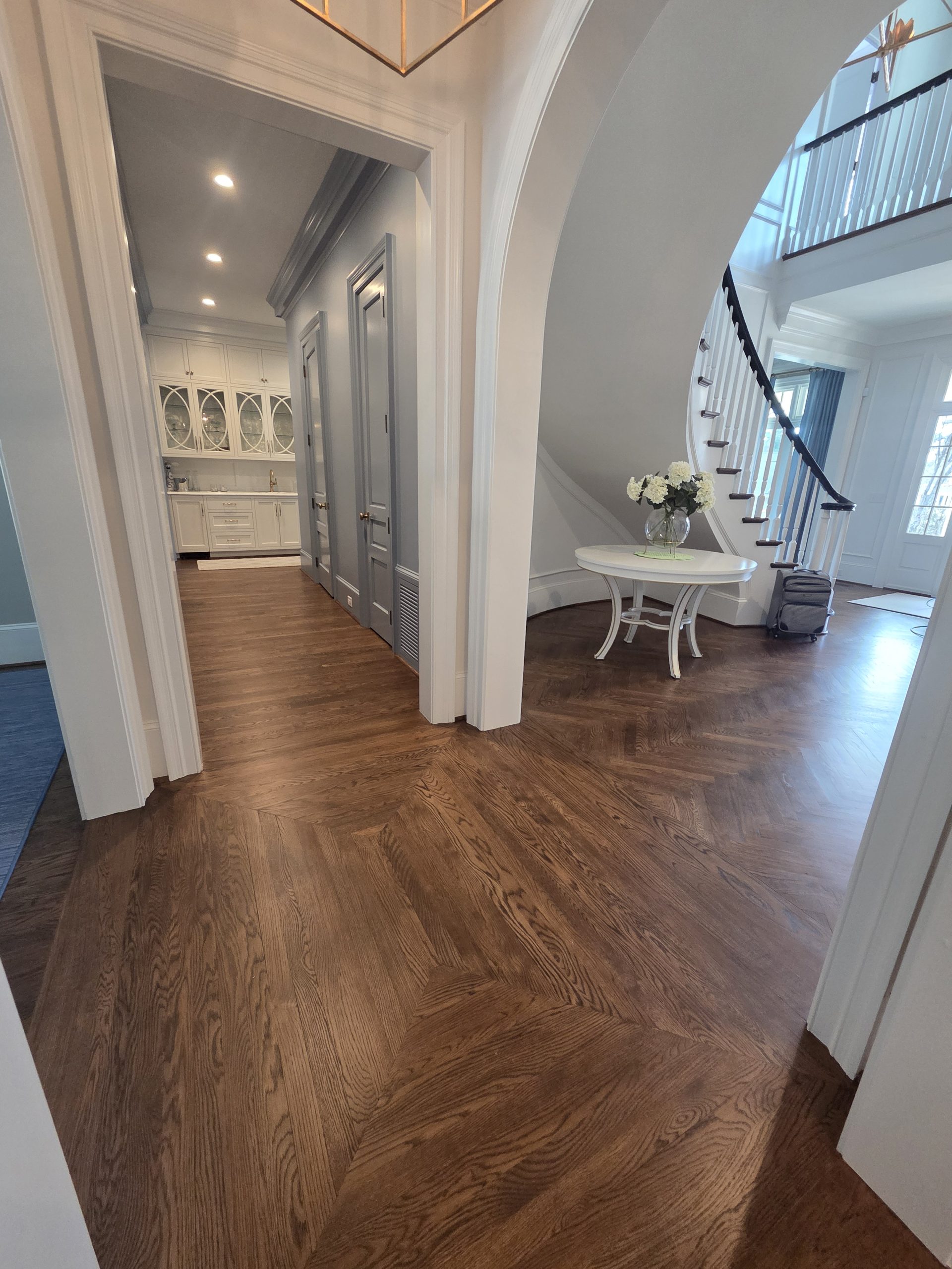 Hardwood flooring installed in a residential hallway and dining area